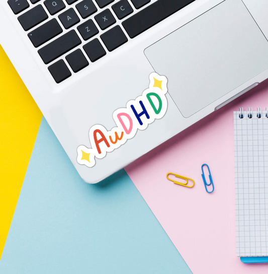 AuDHD sticker on laptop