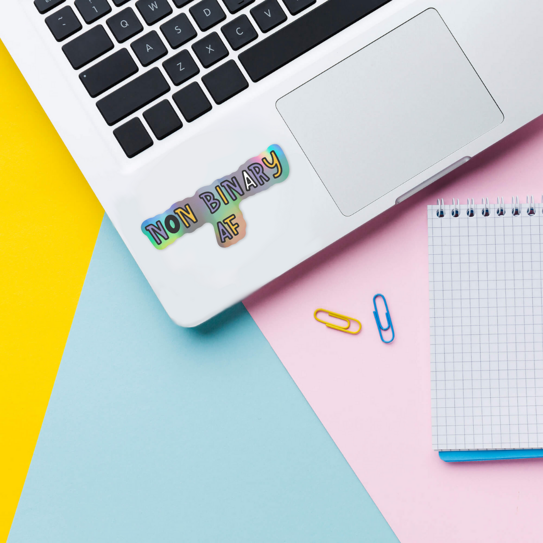 Non binary af holographic sticker on laptop