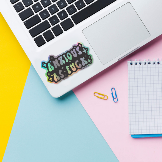 anxious holographic sticker on laptop