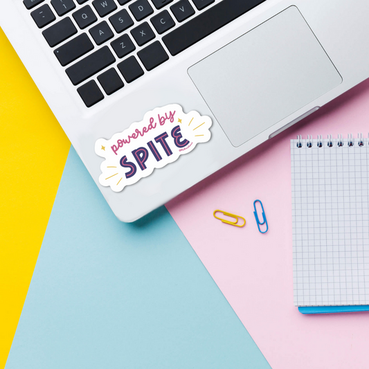 powered by spite vinyl sticker on laptop