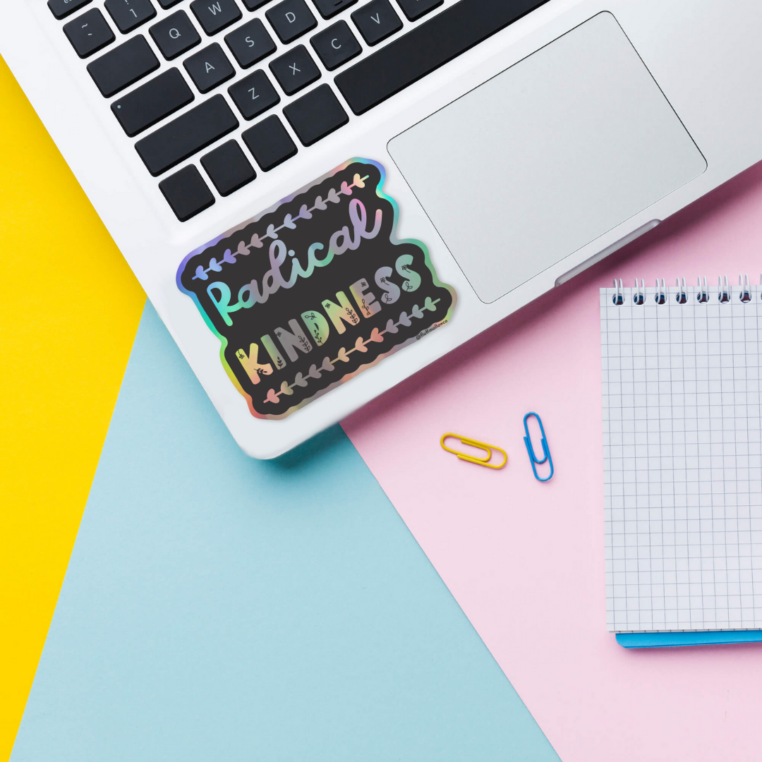 radical kindess holographic vinyl sticker on laptop