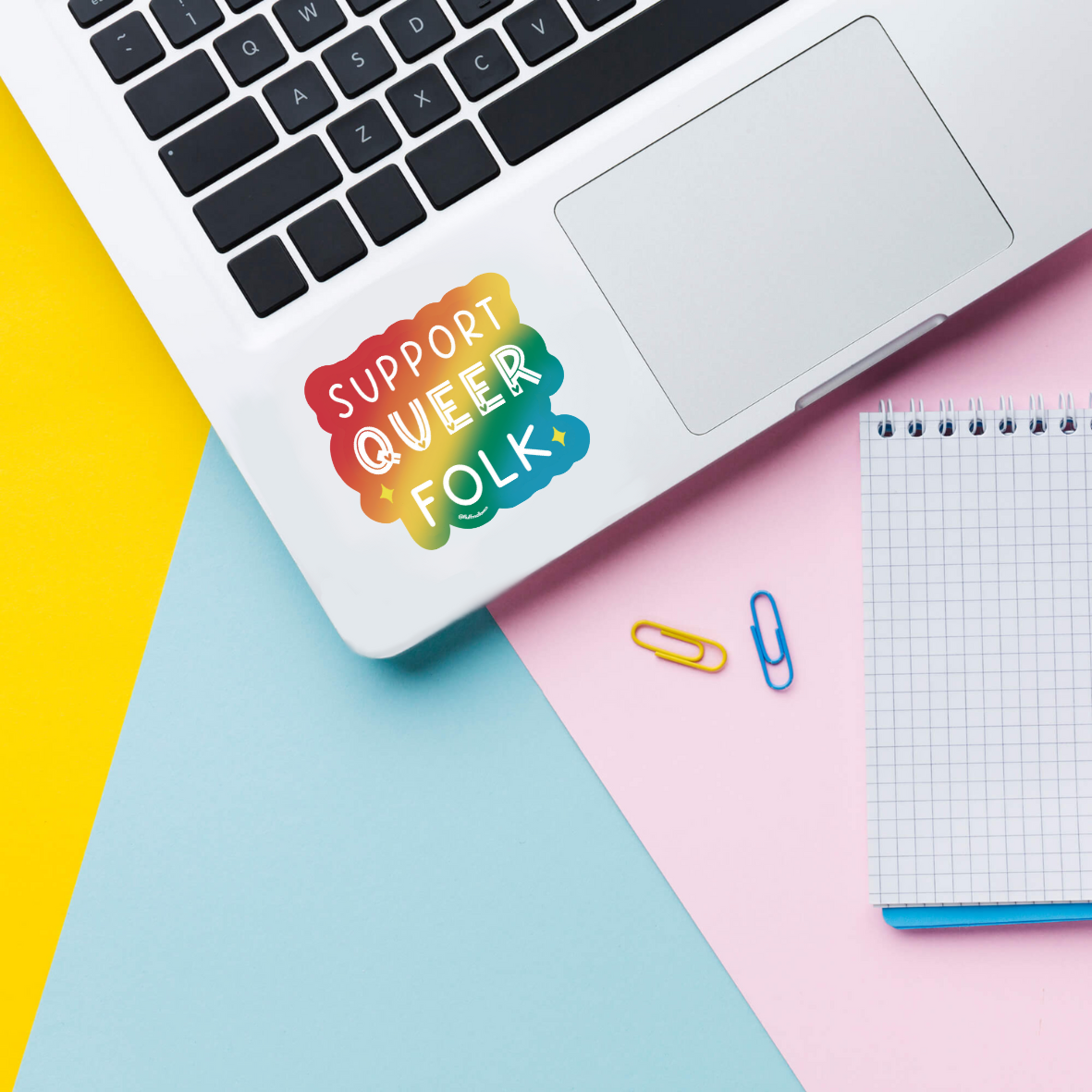 support queer sticker on laptop