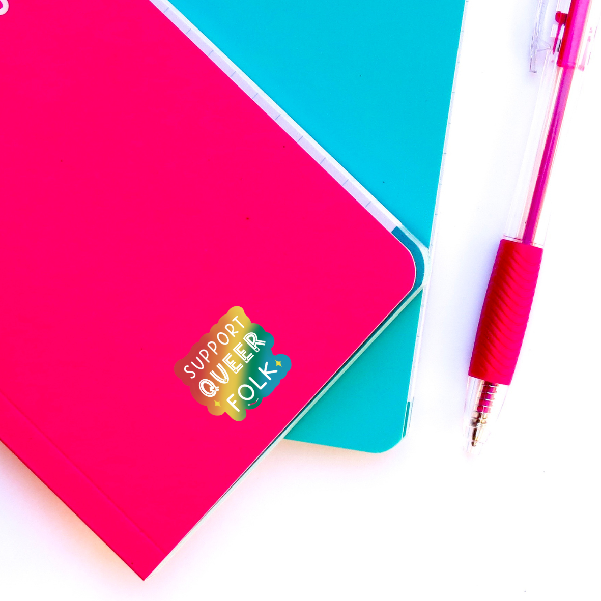 support queer sticker on notebook