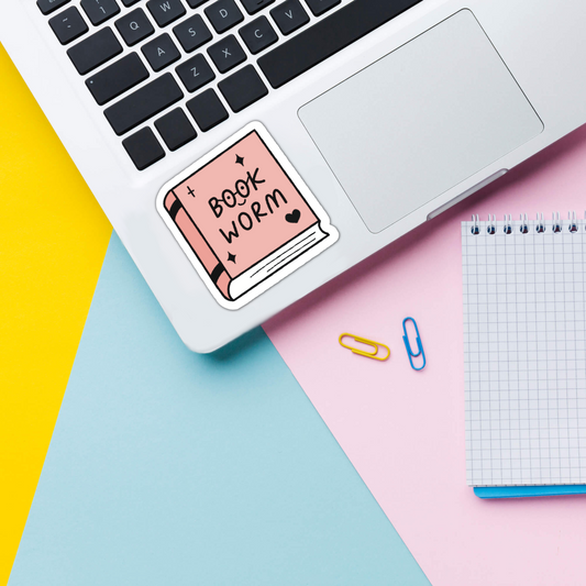 Bookworm reading vinyl sticker on laptop