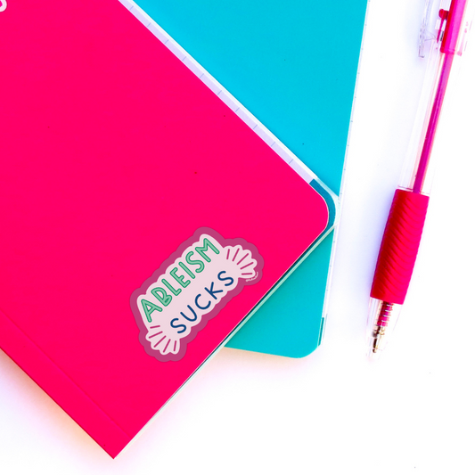 ableism sucks sticker on notebook 