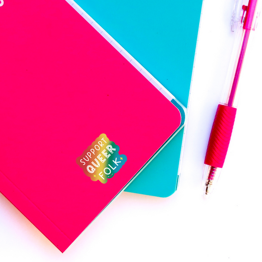 support queer sticker on notebook 